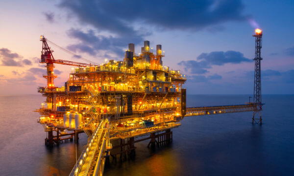 Oil rig lit up at night